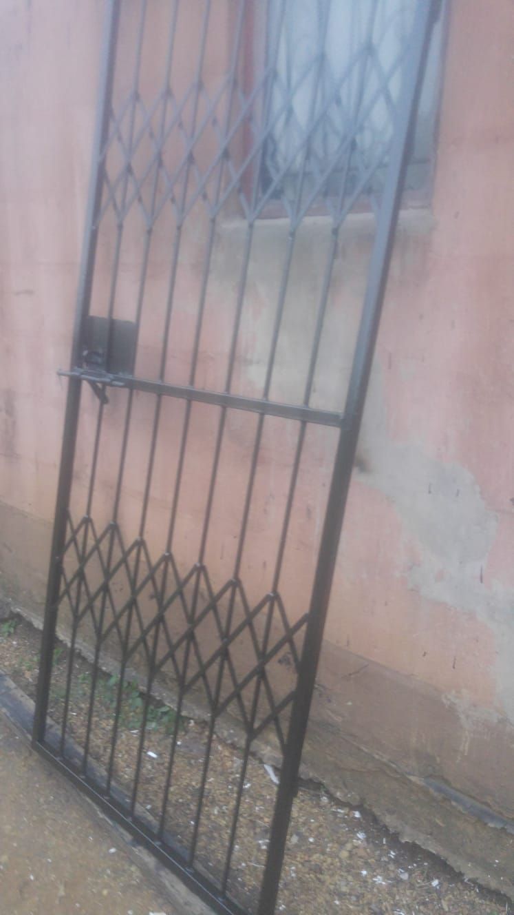 Completed steel trellis security gate with lock mechanism