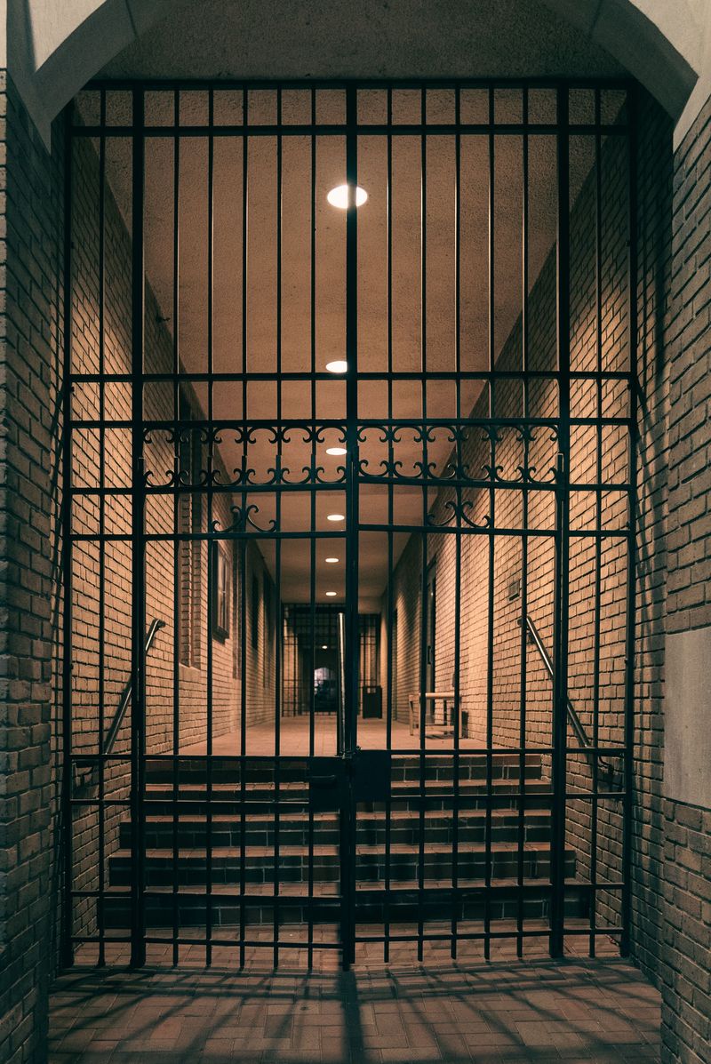 Ornamental wrought iron gate in a brick entrance
